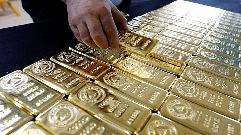 Giá vàng biến động nhẹ khi đồng USD có dấu hiệu phục hồi. Ảnh: Internet 0813-1-kg-gold-bars-commodity-metal-770x433