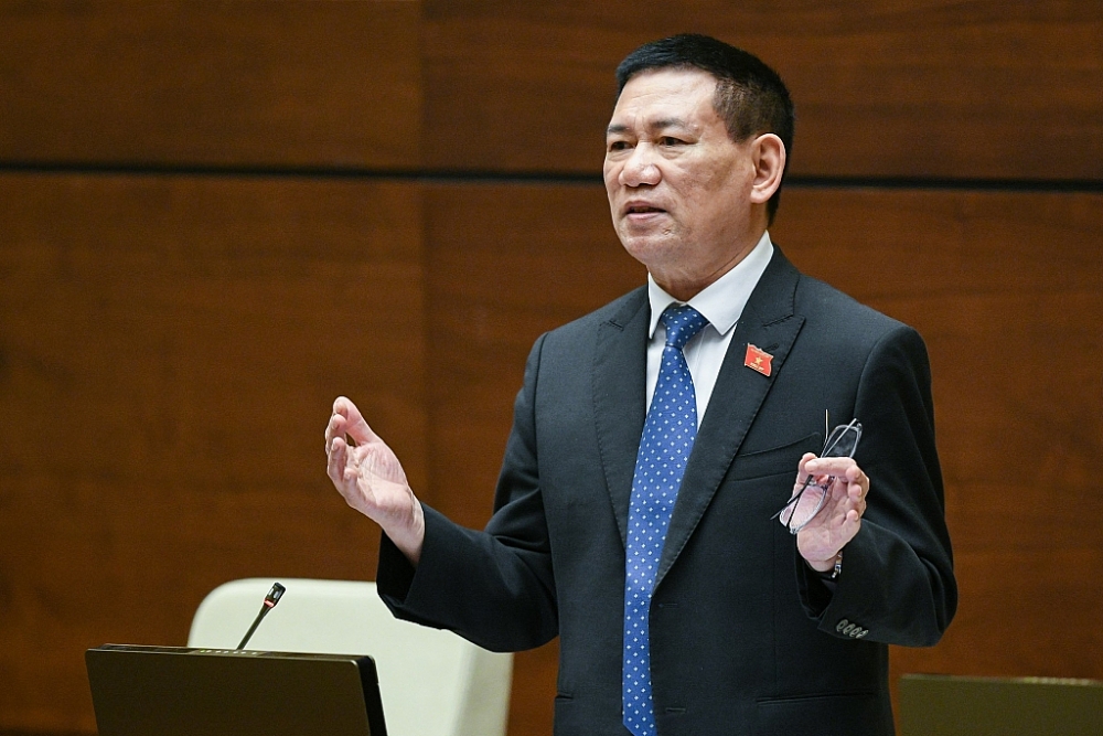 Bộ trưởng Bộ Tài chính Hồ Đức Phớc giải trình trước Quốc hội. Ảnh: Quochoi.vn