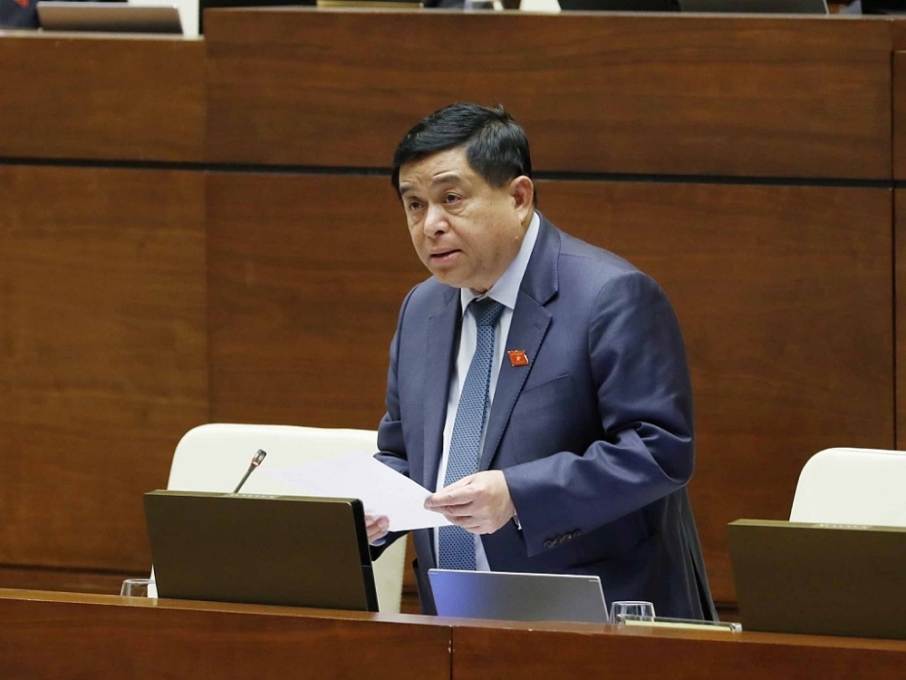 Bộ trưởng Bộ Kế hoạch và Đầu tư Nguyễn Chí Dũng trả lời chất vấn của các đại biểu Quốc hội chiều 11/11/2021. 	Ảnh: TTXVN