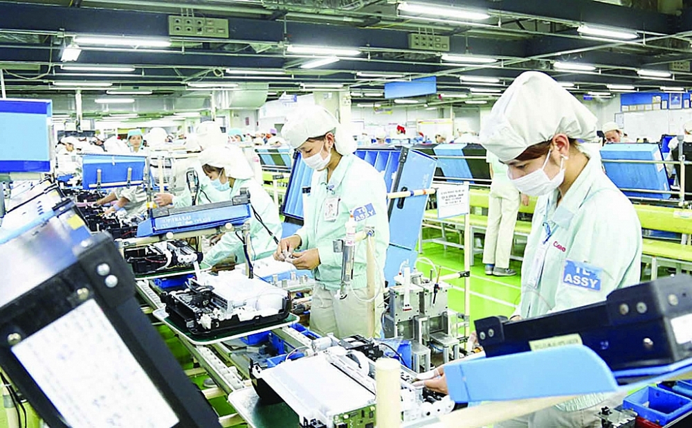 Hoạt động sản xuất tại khu công nghiệp Thăng Long, Hà Nội. 	Ảnh: Nhật Nam